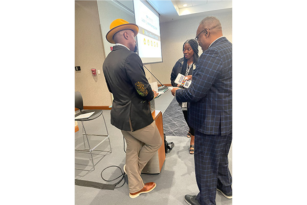 Justin Jones talking with people